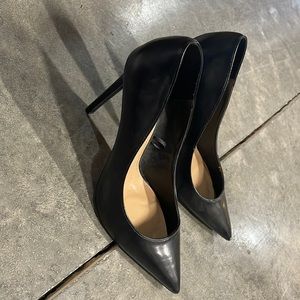 Black pointed toe pumps